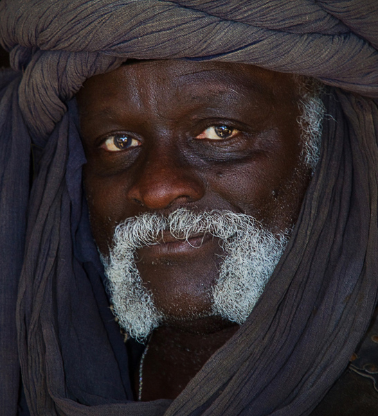 Dark man with white moustache in turban